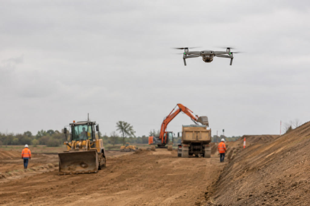 Drone surveying an active construction site for topographic data collection